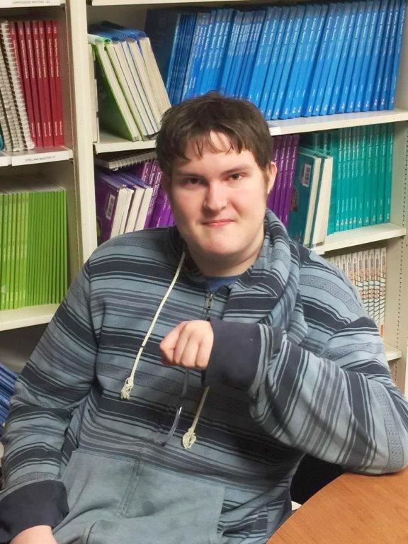 Single student sits at a table 
